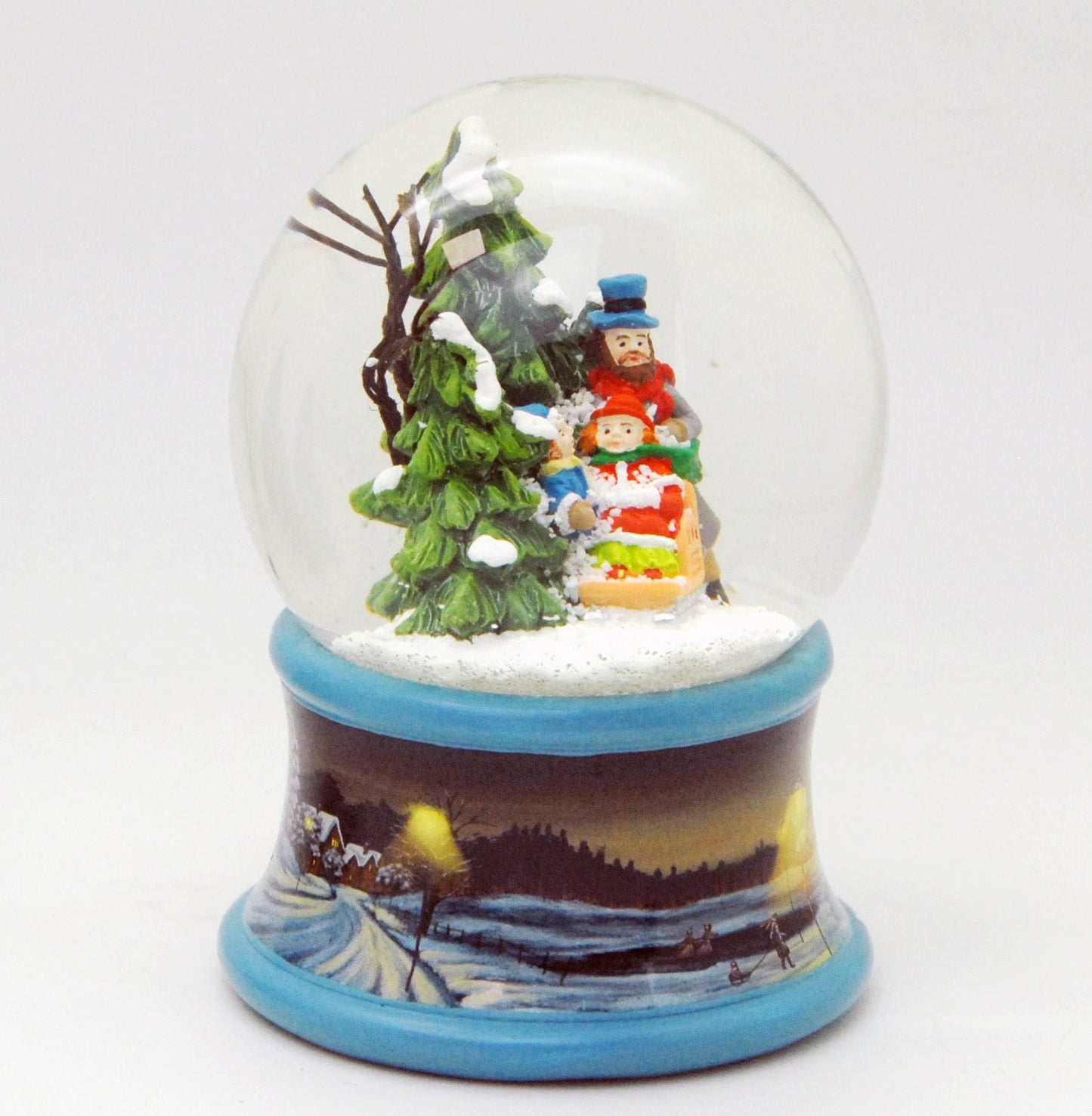 Schneekugel Familie im Winterwald mit Schlitten auf Sockel Winterlandschaft Eisläufer blau mit Spieluhr 10 cm Durchmesser - Schneekugelhaus