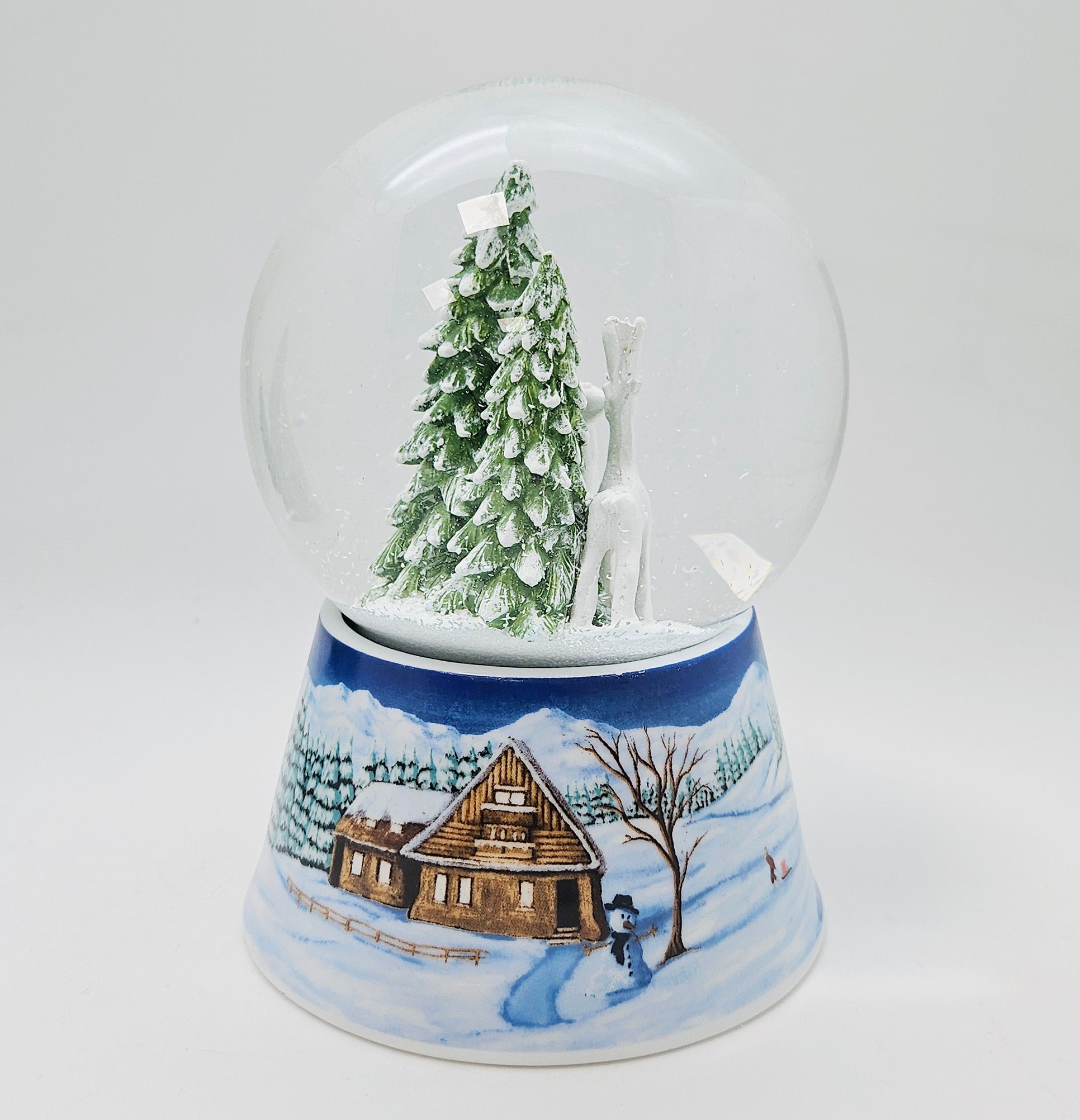 Nostalgische Schneekugel 2 Rehe auf Sockel Winterlandschaft mittelblau 100 mm Durchmesser mit Spieluhr - Schneekugelhaus