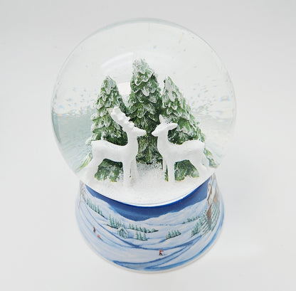 Nostalgische Schneekugel 2 Rehe auf Sockel Winterlandschaft mittelblau 100 mm Durchmesser mit Spieluhr - Schneekugelhaus