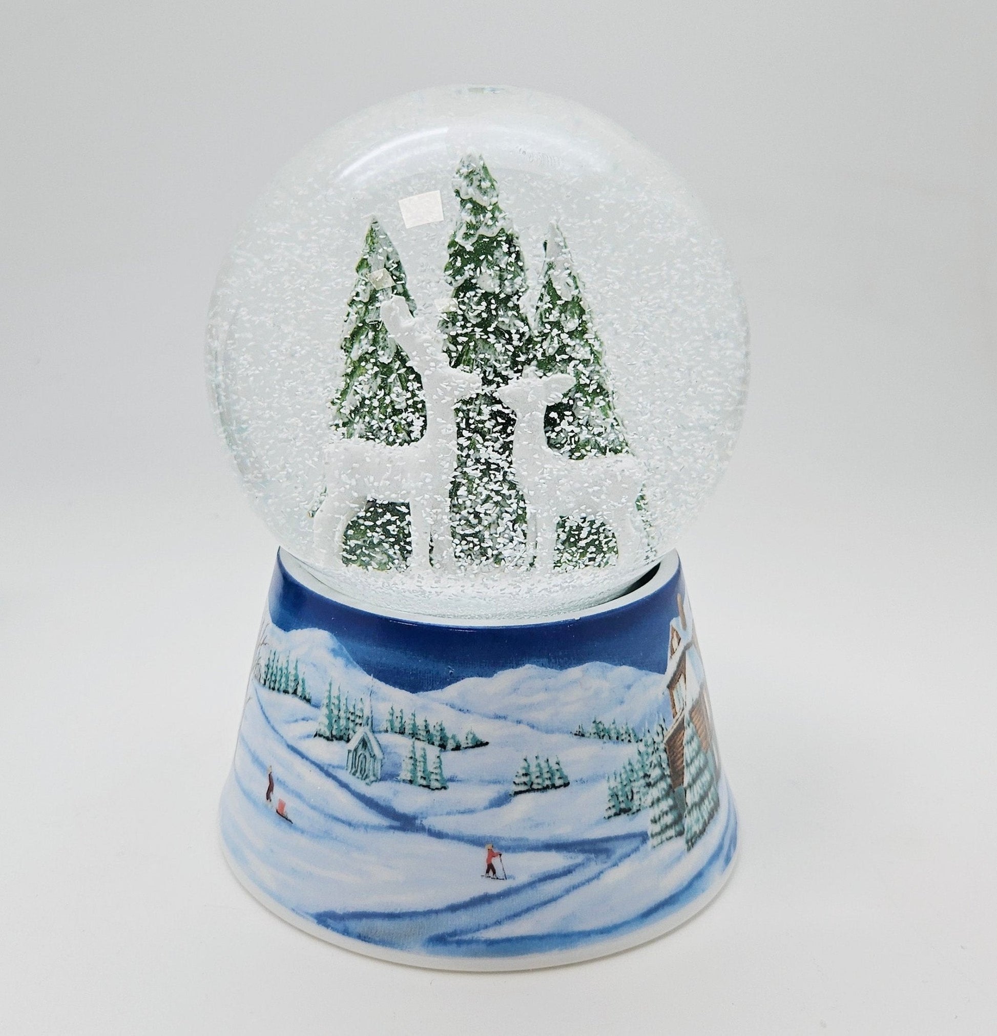 Nostalgische Schneekugel 2 Rehe auf Sockel Winterlandschaft mittelblau 100 mm Durchmesser mit Spieluhr - Schneekugelhaus